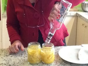 Empty the contents of the bottle in to the jar